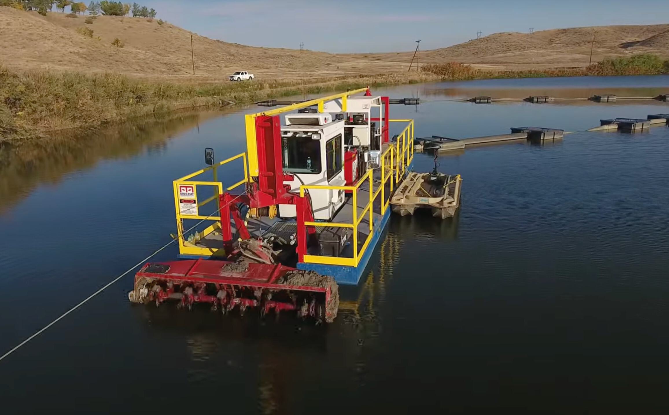 Pond dredging operation using a Hydraulic dredge with rotating cutterhead to remove sediment buildup in a rural retention pond, improving water quality and capacity