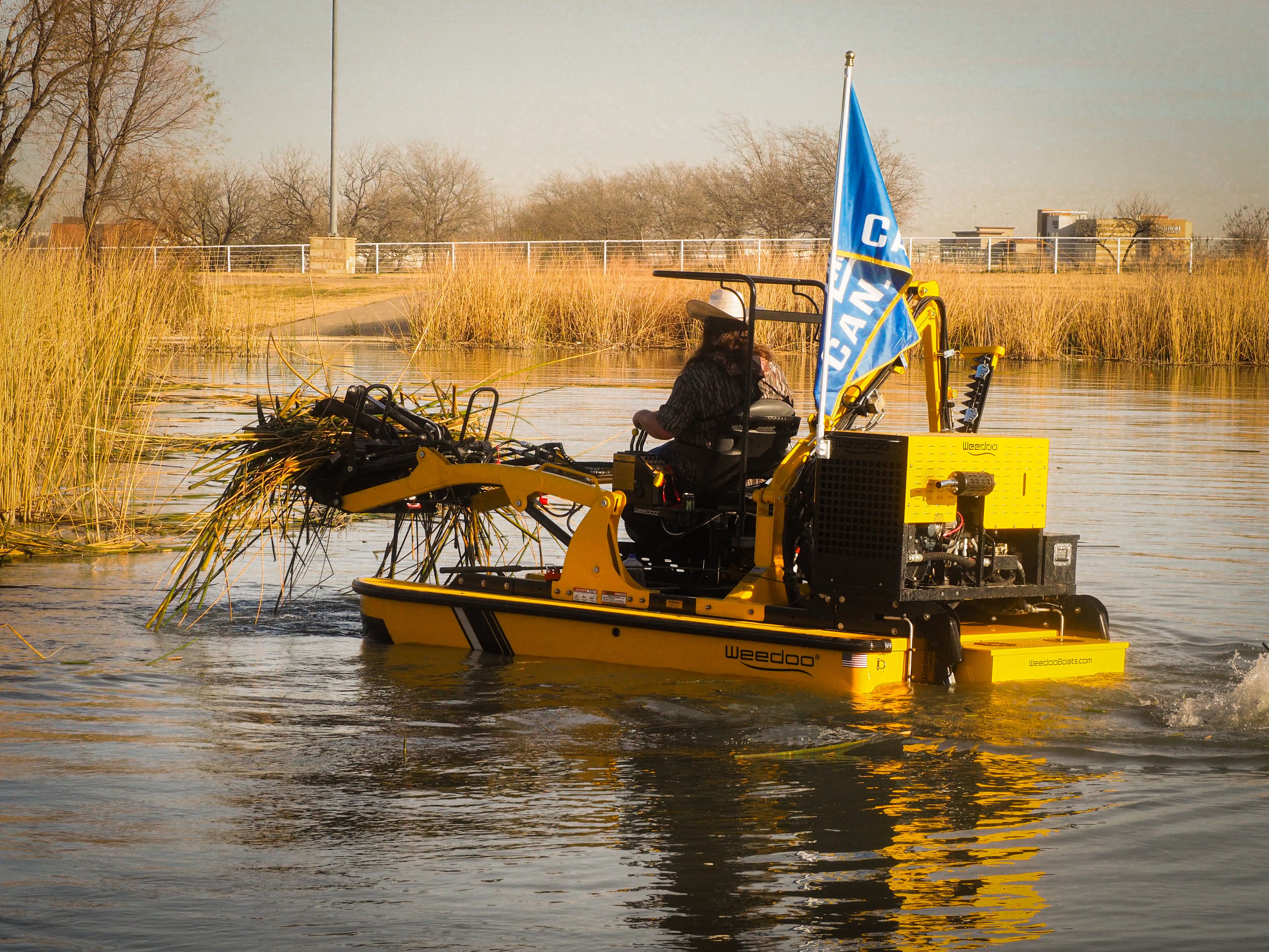A weedoo performing pond cleaning
