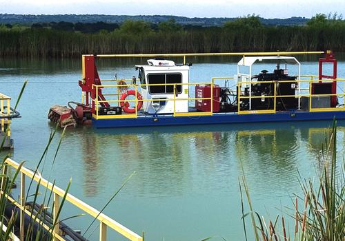 What is dredging dredger dredging a pond